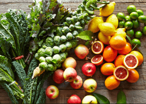a group of fruits and vegetables on a wood surface Healthy Weight Loss Diets Birmingham